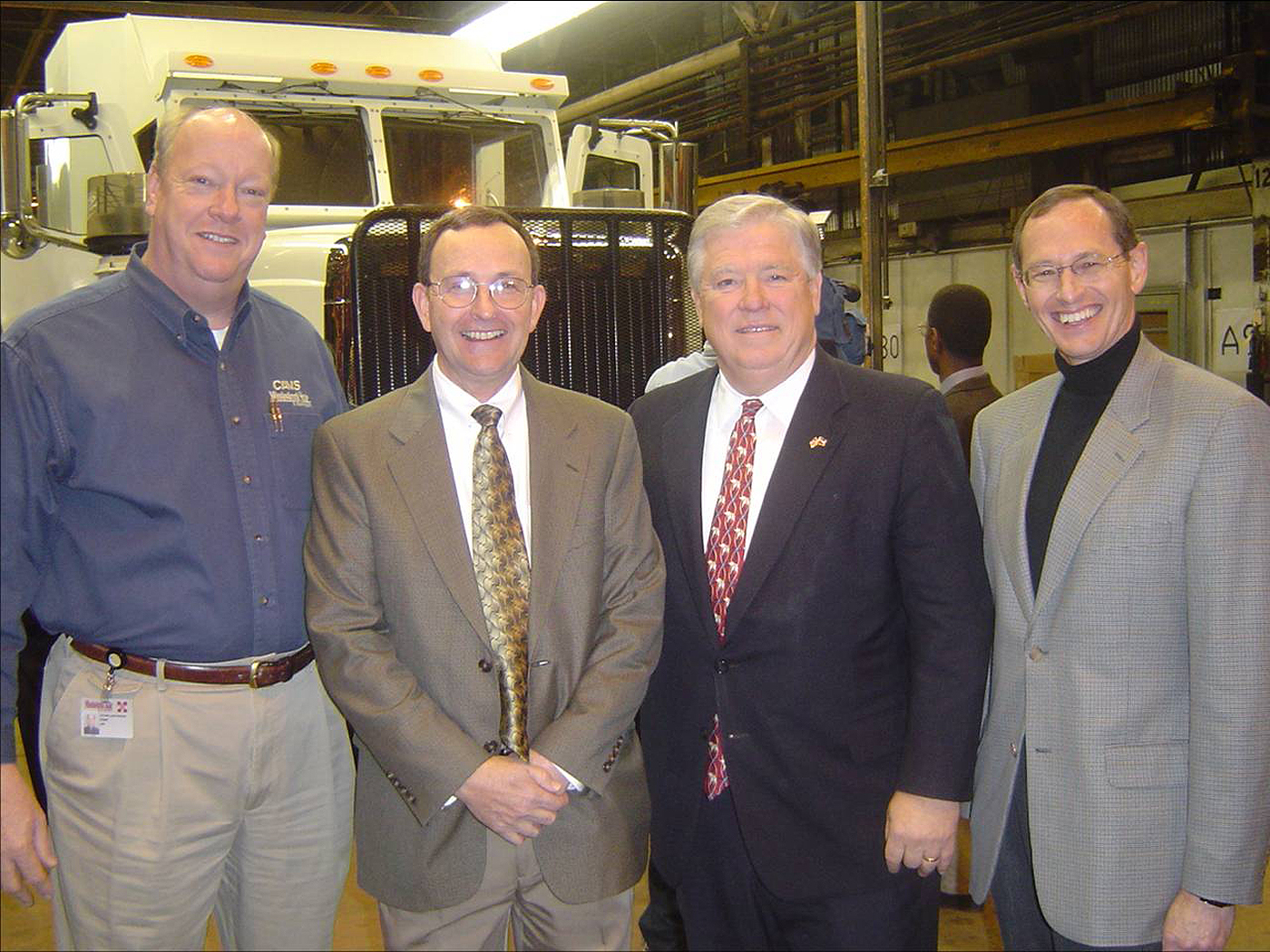 Participating in the recent opening of an armored vehicle manufacturing plant in West Point were (left to right) CAVS associate director Zach Rowland, Glenn Dennis of the CAVS Extension facility in Canton, Mississippi Gov. Haley Barbour and CAVS director Rand German.