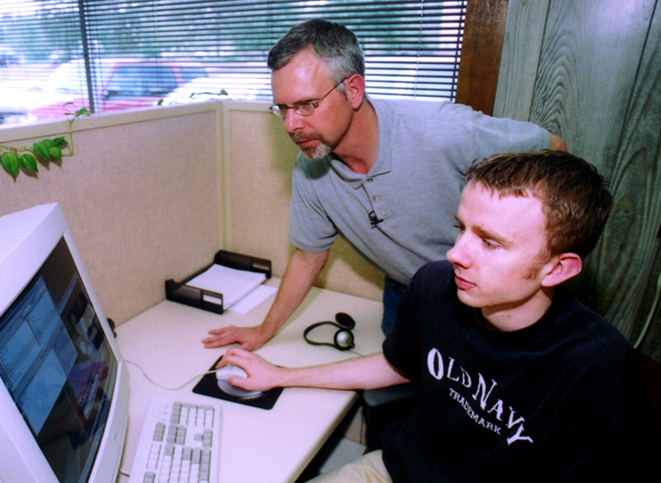 <br /><br />
MSU senior research associate Scott Calhoun (standing) and computer science major Matthew Bennet of New Albany 