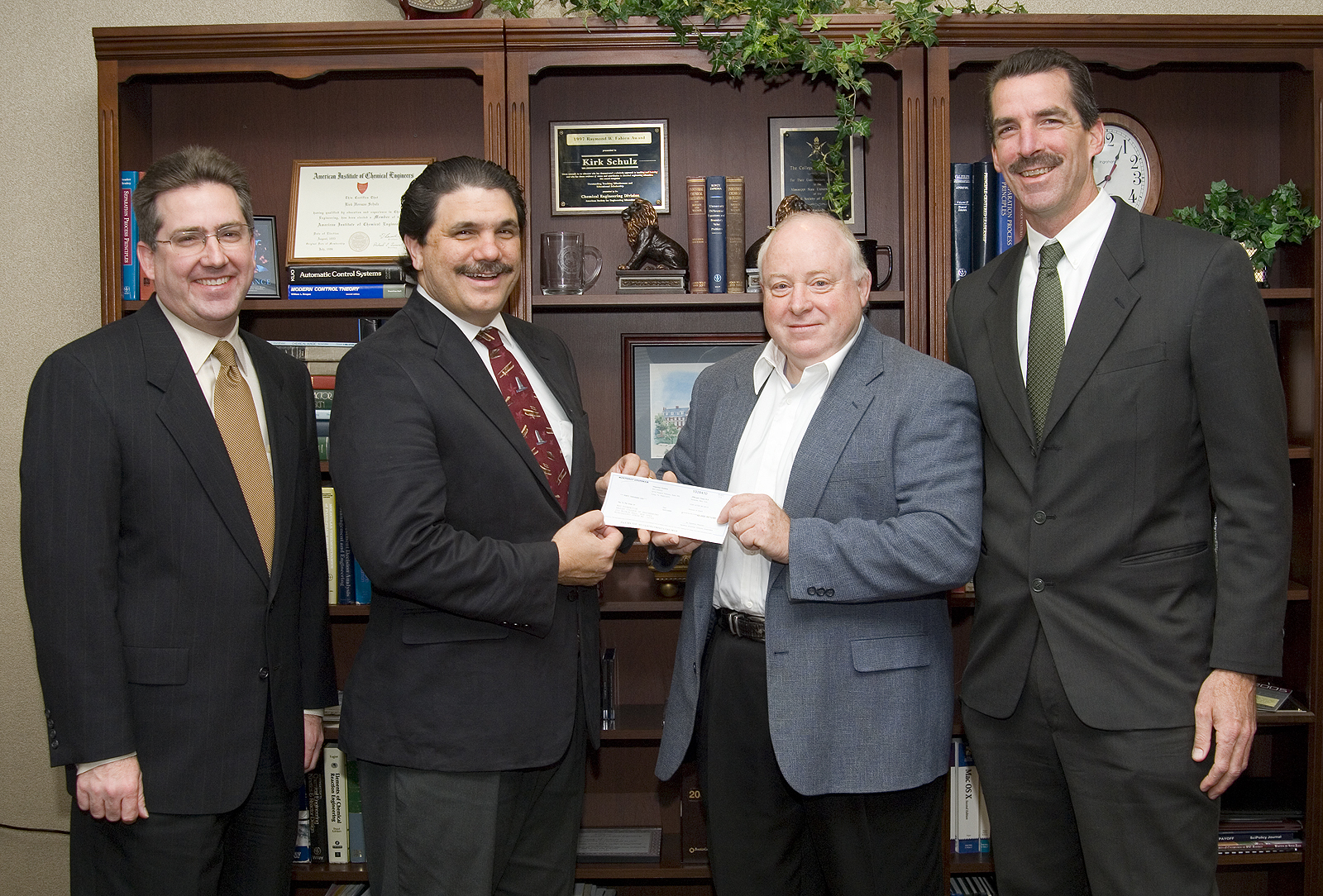 Participating in the $50,000 check presentation ceremony were (l-r) Mississippi State Dean of Engineering Kirk H. Schulz; MSU aerospace engineering professor and  department head Tony Vizzini; Allen Lockyer, manager of Advanced Structures Development, Integrated Systems, Western Region, for Northrop Grumman; and Northrop Grumman's Tod Palm, Integrated Product Team Leader, Integrated Systems, Western Region.