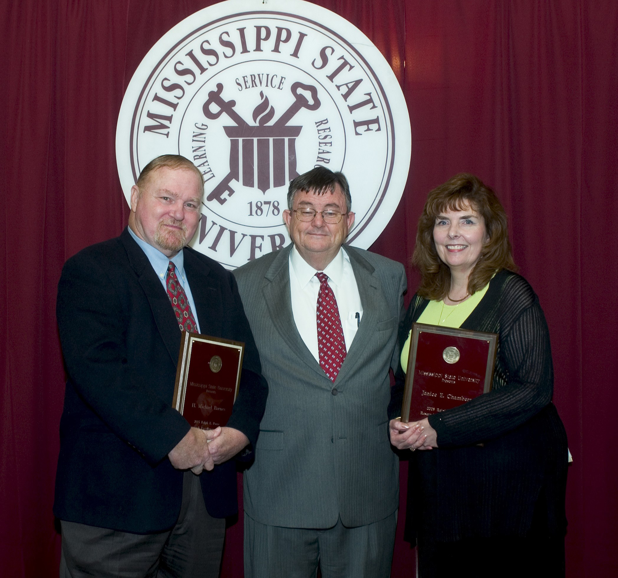 MSU President Charles Lee presented the 2005 Ralph Powe Research Excellence Awards to forestry products professor Michael Barnes and environmental health sciences professor Janice Chambers.