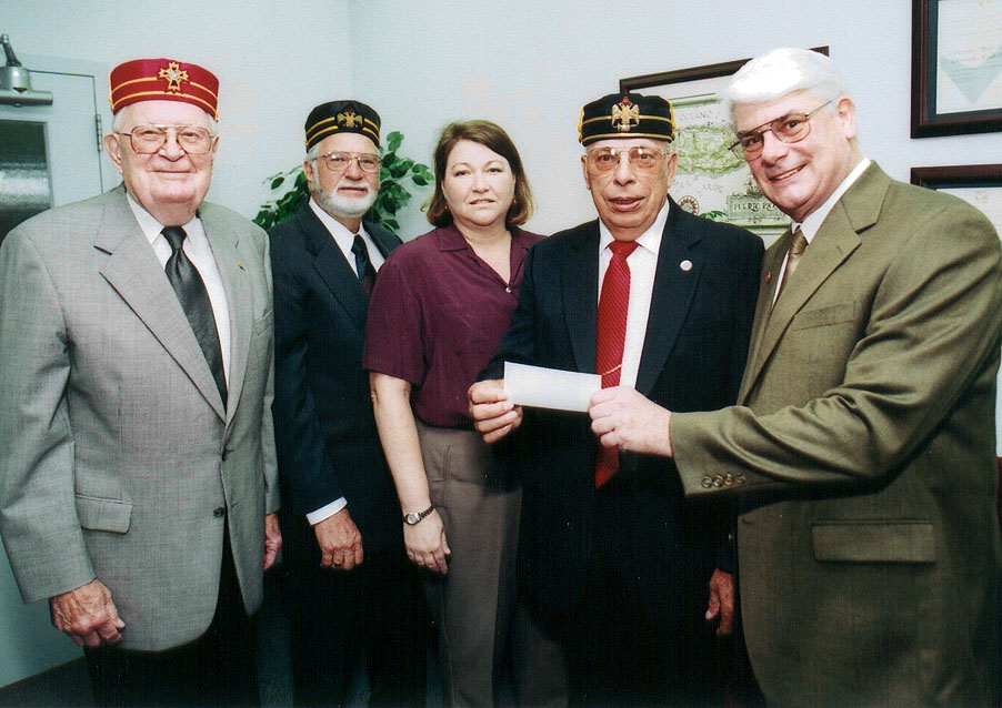 <br /><br />
Lowndes Scottish Rite Association officers recently established a scholarship fund at MSU. Association officers (from left) Charles Waldron, Ed Humphries and Wilbur Hartle (second from right) made the presentation to Carlen Henington and Thomas Hosie.