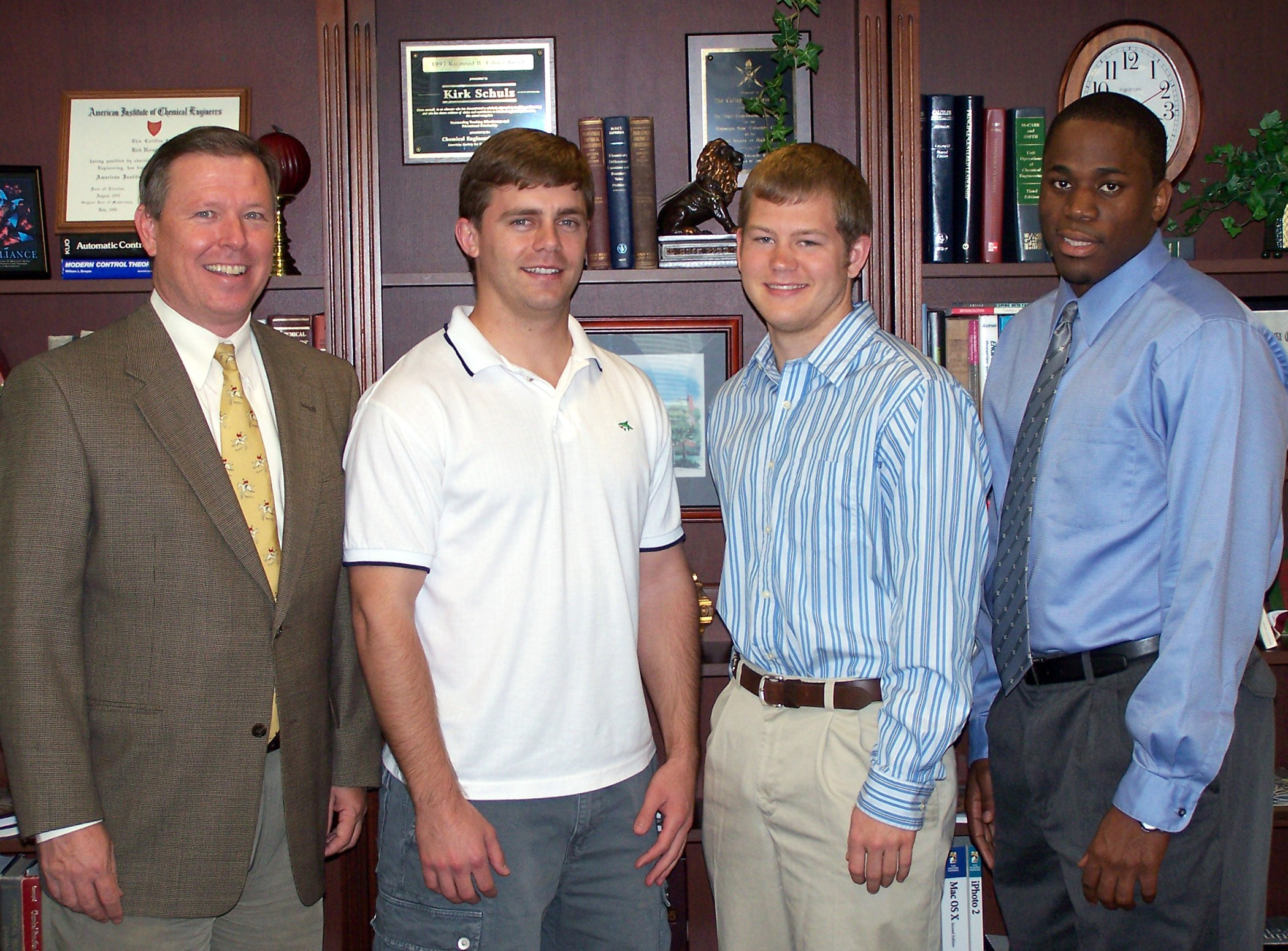 Gerald Nelson, from left, director of entrepreneurship for the Bagley College of Engineering, recognizes 2005 Jack Hatcher business plan competition student winners Harold S. "Tommy" Thompson III of Decatur, Ala., Jeremy Wolfe of Vicksburg and Byron Williams of Jackson. Other winners not present were students Kyle Miller of Moss Point and Blake Webster of Florence.