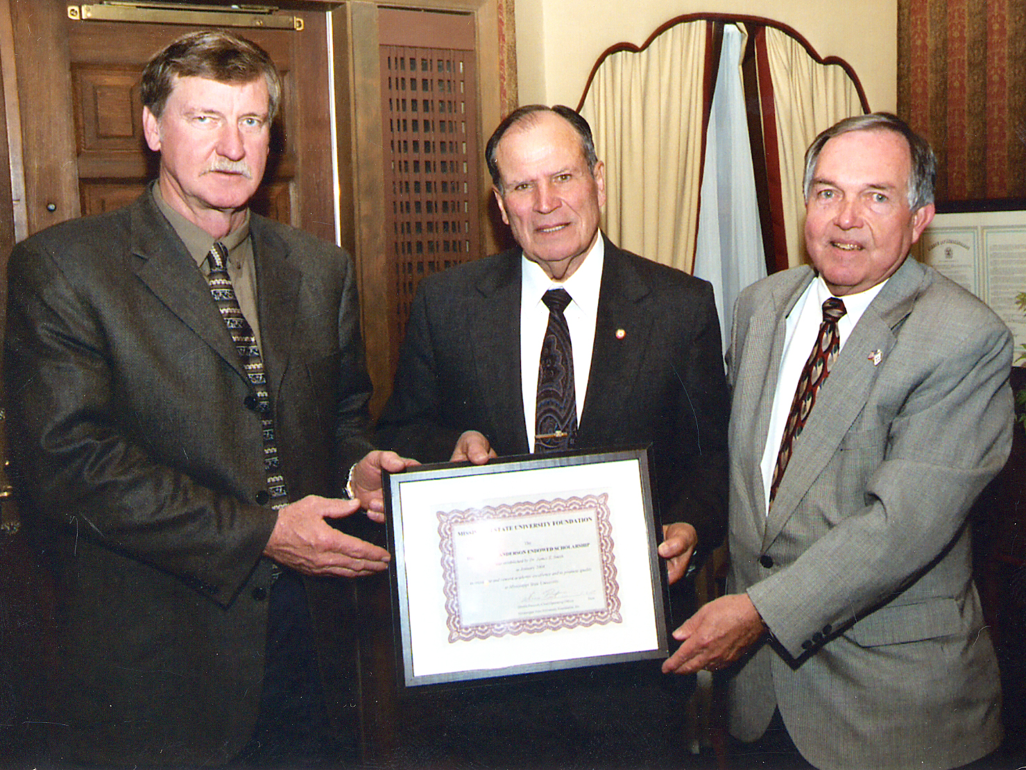 <br /><br />
Cleveland agribusinessman James Smith (l) with retired MSU administrator Kelton Anderson (c) and Vance Watson, the university's vice president for agriculture, forestry and veterinary medicine. 