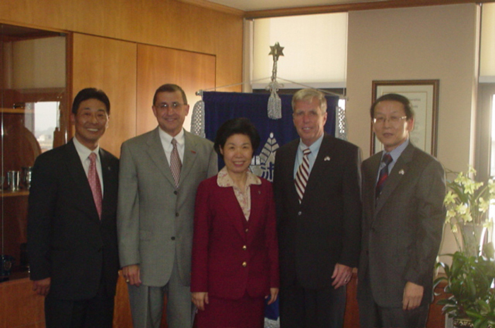 External affairs and development Dean H. K. Kim (left) and President Kyungsook Lee of South Korea's Sookmyung Women's University welcomed MSU Alumni Association executive director Jimmy Abraham (second from left), President Robert H. "Doc" Foglesong and MSU business professor J.P. Shim (right). 