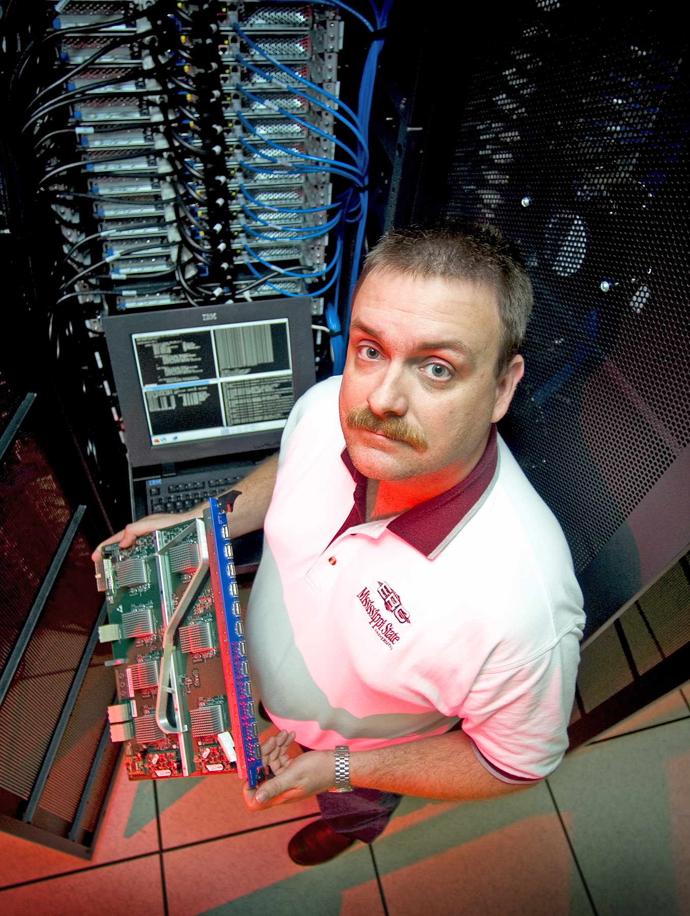 <br /><br />
Roger Smith, surrounded by MSU's Maverick supercomputer<br /><br />
 