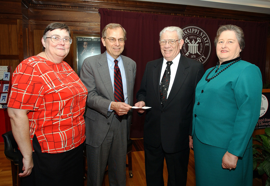 <br /><br />
Census data recently provided to MSU by Starkville residents E.O. and Betty Templeton (r) were accepted by reference librarian Lynne Mueller and associate provost George Rent. 