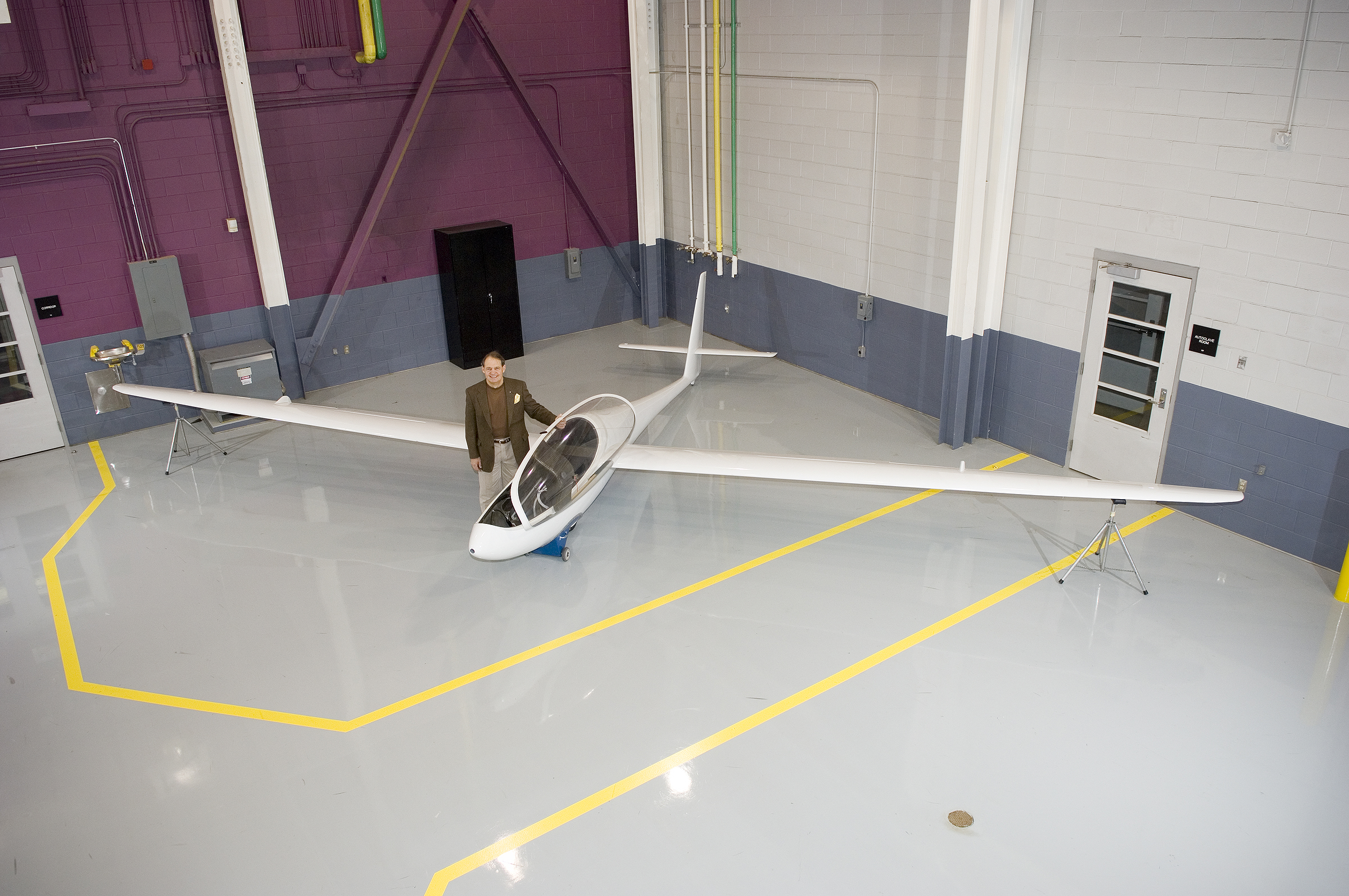 David Lawrence, director of Mississippi State's Raspet Flight Research Laboratory, shows off a model of a new unmanned aerial vehicle, called the Owl, now under development at the lab.