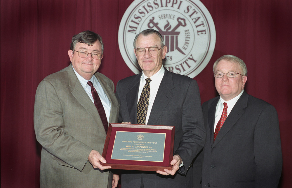 <br /><br />
Alumnus of the Year Will Carpenter (c) is congratulated by MSU President Charles Lee (l) and E. Allen Maxwell of New Albany, national MSU Alumni Association president. 