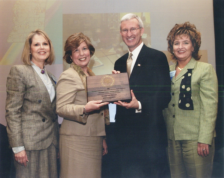 <br /><br />
MSU Writing-Thinking Institute director Sherry Swain (second from left) receives the state honor from Gov. Ronnie Musgrove.  Also pictured are institute staff leaders Linda Irby (at left) and Kim Patterson. 